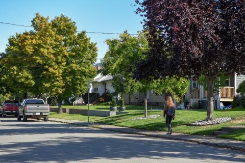 A woman walking in a boulevard