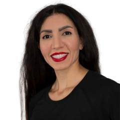 professional photo of woman with black hair wearing a black shirt